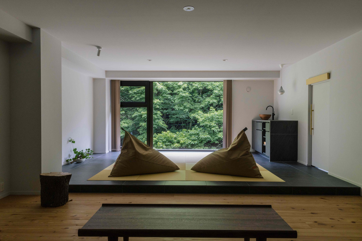 Guest rooms offering a contemporary take on tōji—a traditional Japanese practice of staying in hot spring areas for healing.