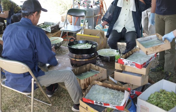 Tempura being made in a huge oil pot.