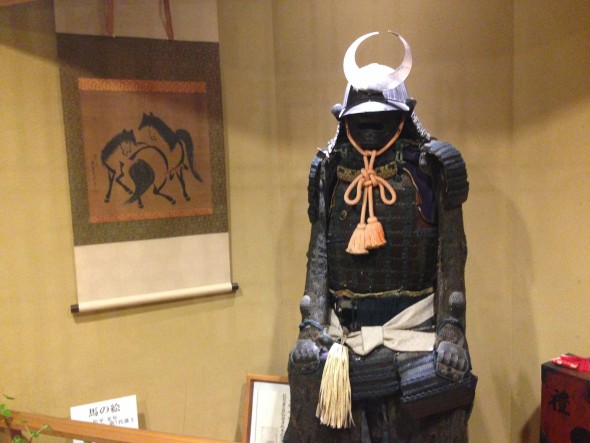 Samurai armor displayed at the entrance of the ryokan