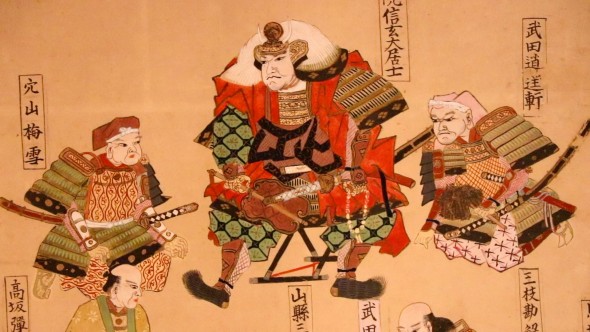 Takeda stands at the top of a painting of his descendants.