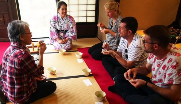 Visitors learning the traditional Japanese tea ceremony and how to make matcha