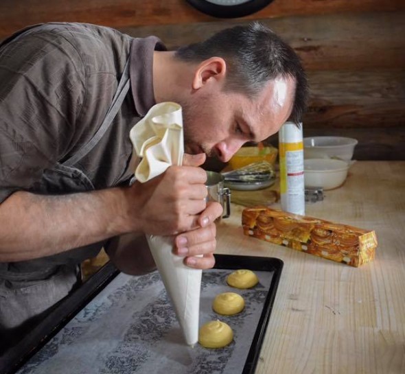 Squeezing out dough for creme puffs