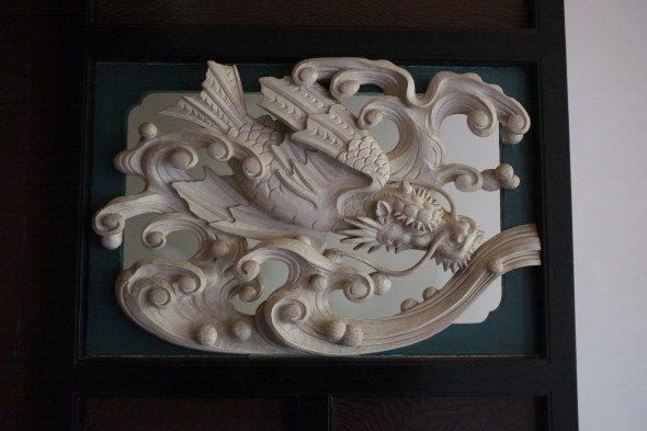 Carving with a dragon and a wave.