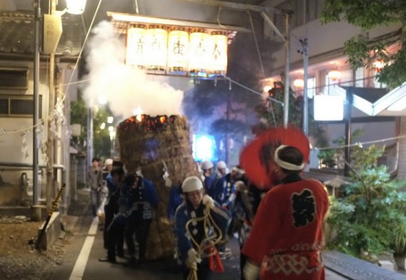 Torch passing under the lantern light arches