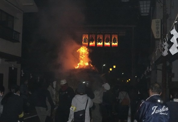Torch passing under the lantern light arches