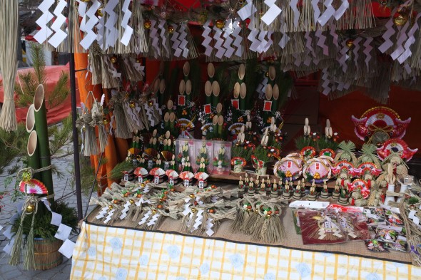 New Year's decorations lined up on one of the market tables.