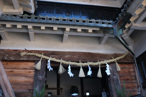 The shimenawa across the castle tower entrance