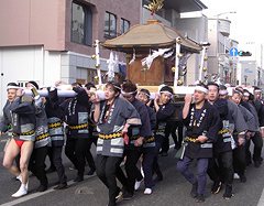 Carrying a mikoshi around the streets