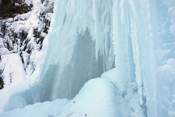 Part of the waterfall still flowing under its partially frozen exterior