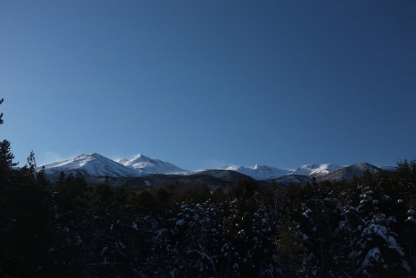 Wind blowing the snow from the peaks of Norikuradake