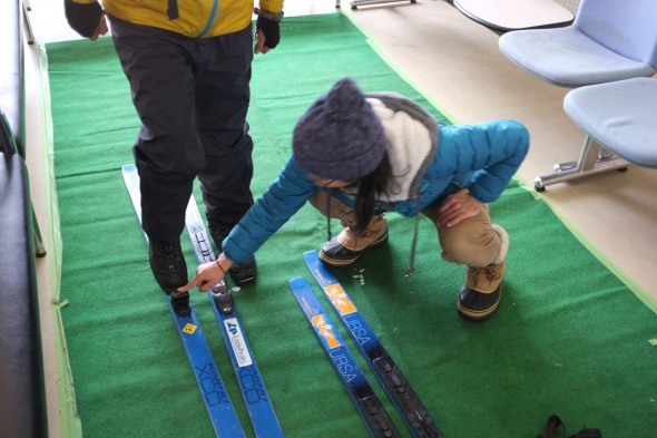 Getting taught how to use the skis