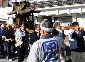 Carrying a portable shrine in 